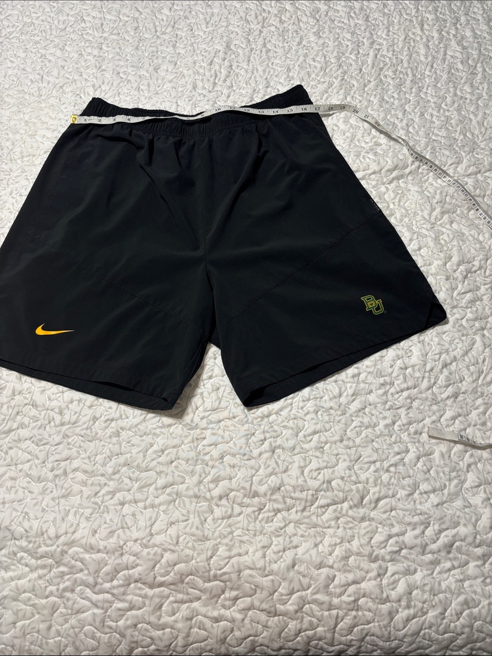 Nike Men’s Black Athletic Shorts with Yellow Swoosh Accent